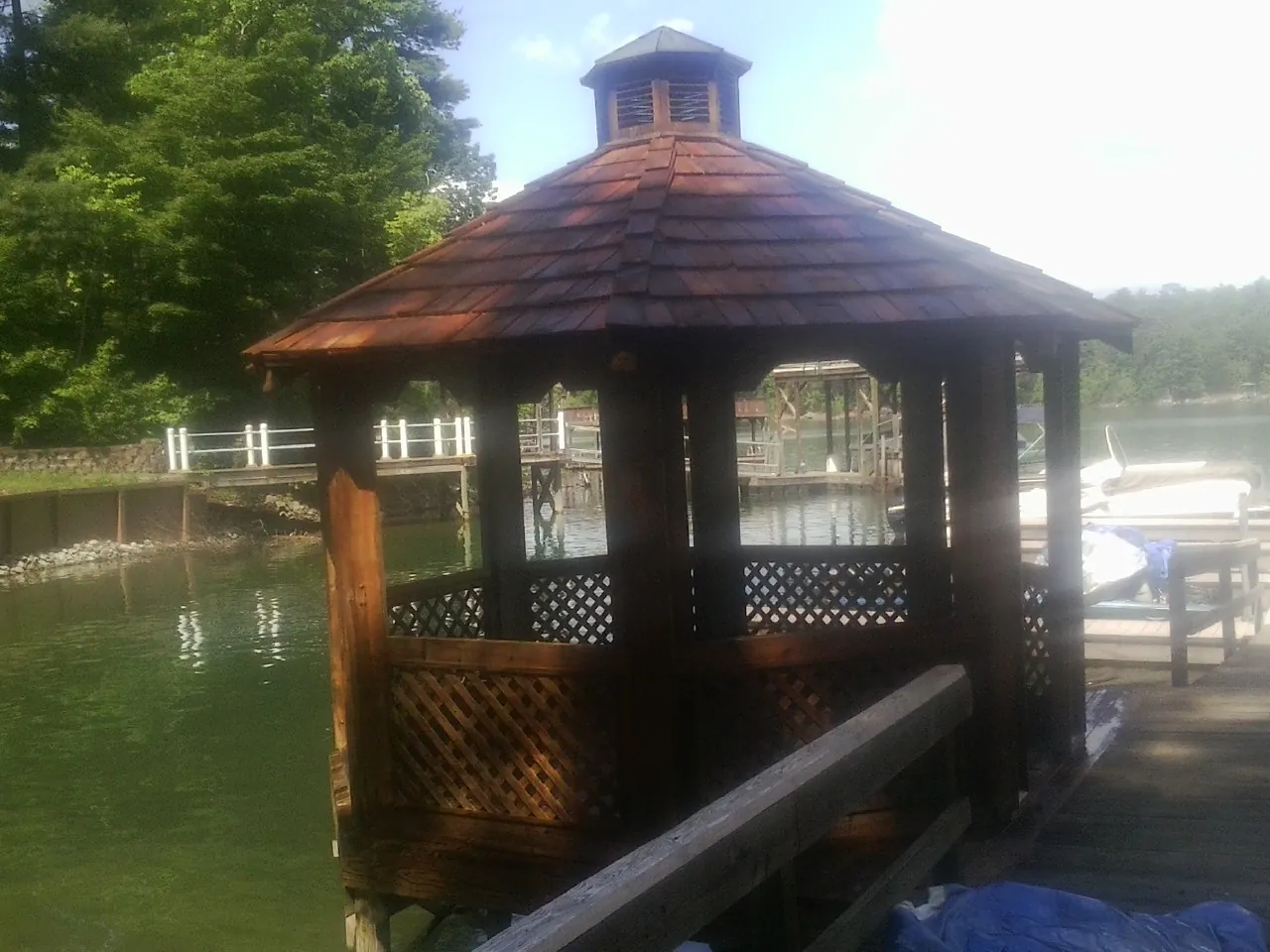 Cedar shake gazebo roof rebuilt on a lake dock in Urbanna